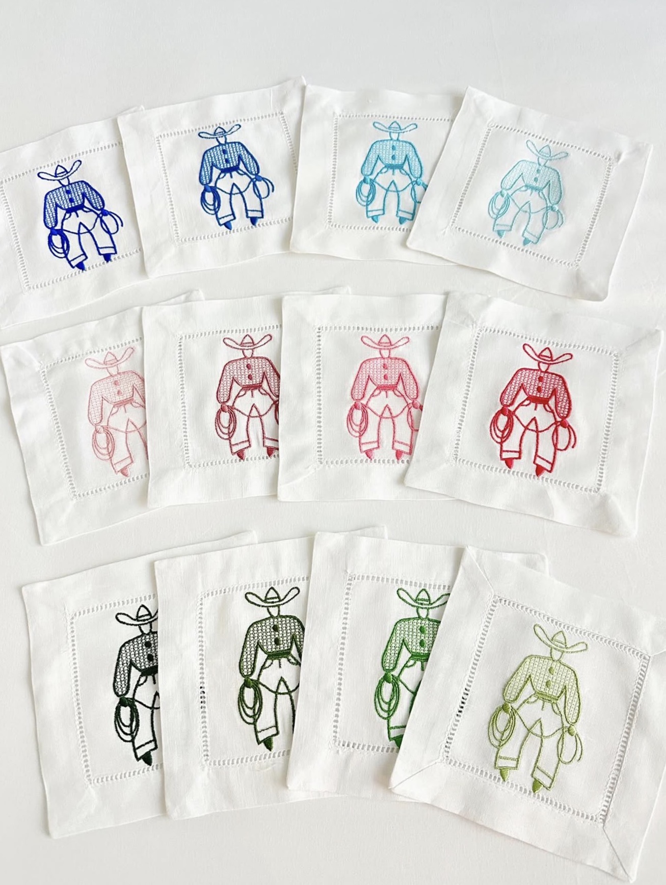 Cowboy embroidered linen cocktail napkins in multiple thread colors